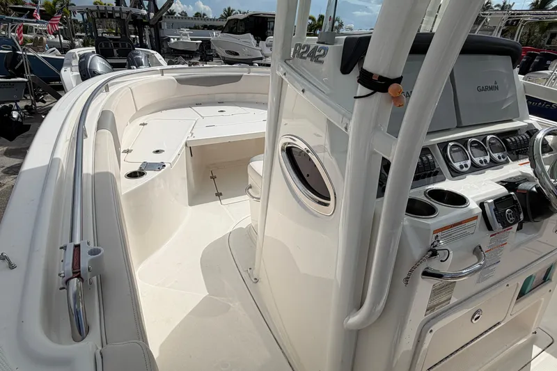 Slide: The Image of 2017 Robalo R242 Center Console boat interior with Garmin navigation system and spacious seating. - 32
