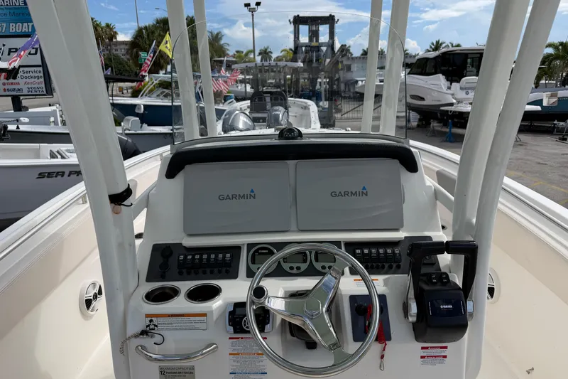 Slide: The Image of 2017 Robalo R242 Center Console boat dashboard with Garmin navigation system. - 17