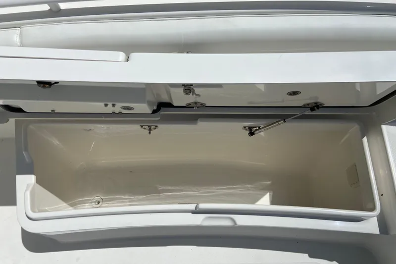 Slide: The Image of Open storage compartment on a 2021 Regulator 28 boat, showcasing interior space. - 39