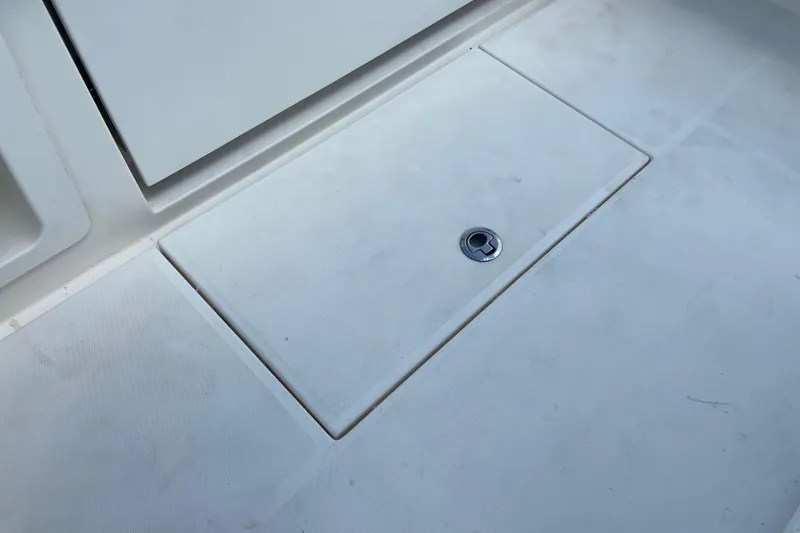 Slide: The Image of Deck hatch on a 2021 Regulator 28 boat, featuring a sleek, clean design. - 19