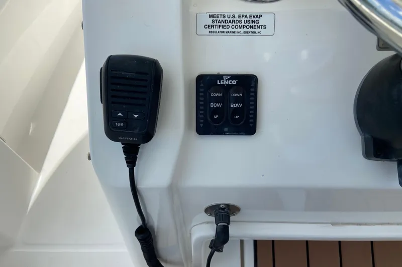 Slide: The Image of Control panel of a 2021 Regulator 28 boat with Garmin and Lenco devices. - 29