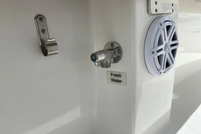 Slide: The Image of Fresh water outlet and speaker on 2021 Regulator 28 boat. - 23