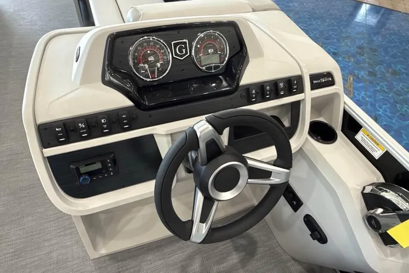 Slide: The Image of Steering console of 2026 Godfrey Sweetwater 2286 SB pontoon boat with modern controls. - 13