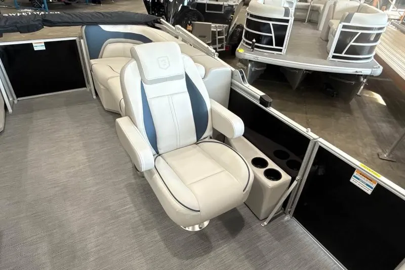 Slide: The Image of Luxurious seating on 2026 Godfrey Sweetwater 2286 SB pontoon boat, featuring cup holders and modern design. - 11