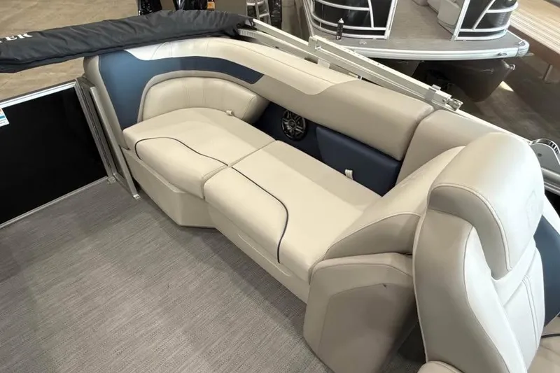 Slide: The Image of 2026 Godfrey Sweetwater 2286 SB boat interior with beige seating and modern design. - 14