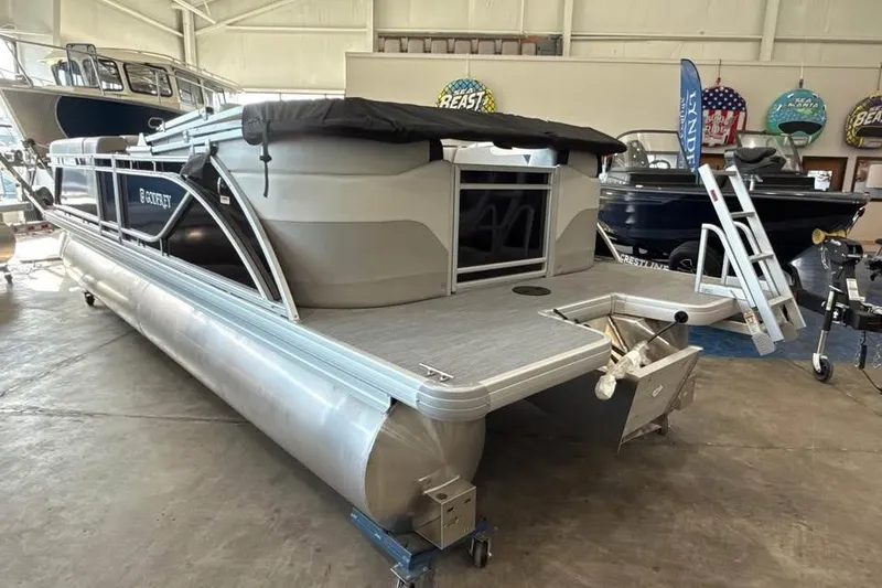 Slide: The Image of 2026 Godfrey Sweetwater 2286 SB pontoon boat displayed in a showroom. - 5