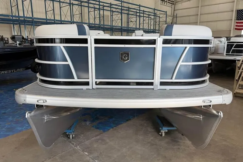 Slide: The Image of 2026 Godfrey Sweetwater 2286 SB pontoon boat in showroom, featuring sleek design and modern finish. - 3