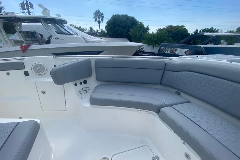 Slide: The Image of 2019 Pursuit S 328 Sport boat with spacious seating and modern design. - 29