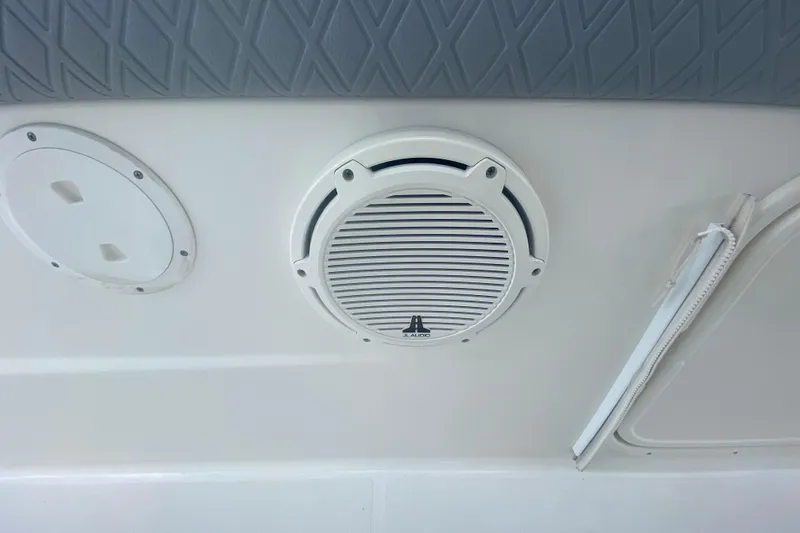 Slide: The Image of 2019 Pursuit S 328 Sport boat interior with JL Audio speaker and panel. - 40