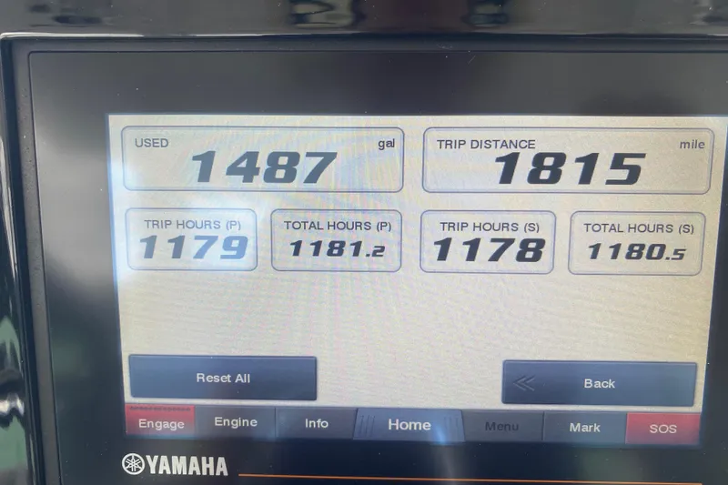 Slide: The Image of Yamaha display showing trip data: 1487 gallons used, 1815 miles traveled, 1180.5 total hours. - 43