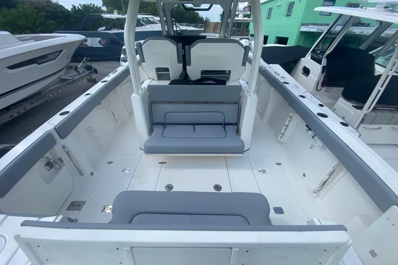 Slide: The Image of 2019 Pursuit S 328 Sport boat interior with seating and storage compartments. - 10