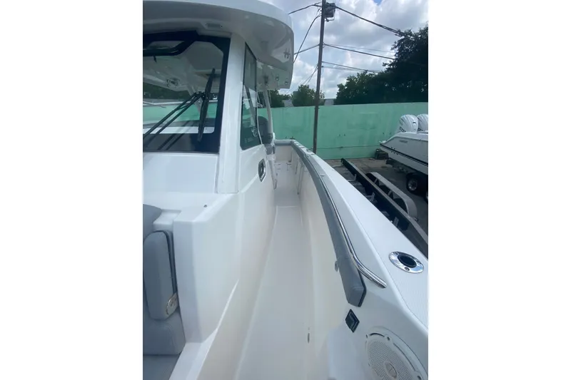 Slide: The Image of 2019 Pursuit S 328 Sport boat deck with sleek design and modern features. - 33