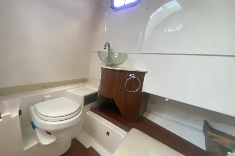 Slide: The Image of 2019 Pursuit S 328 Sport boat bathroom with modern sink and toilet. - 39
