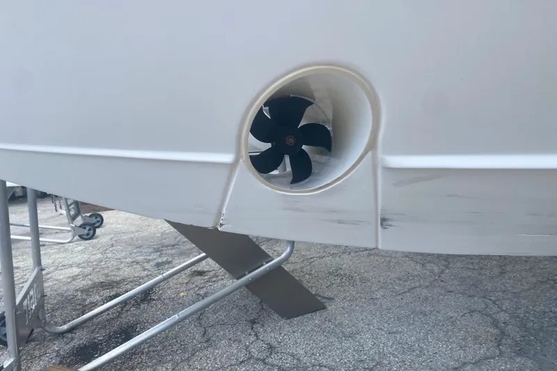 Slide: The Image of 2019 Pursuit S 328 Sport boat with visible bow thruster on hull. - 42
