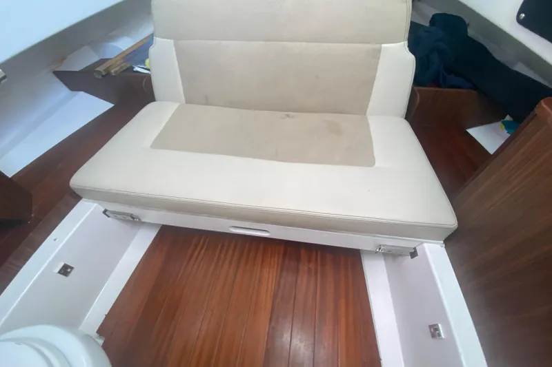 Slide: The Image of 2019 Pursuit S 328 Sport interior with beige seating and wooden flooring. - 34