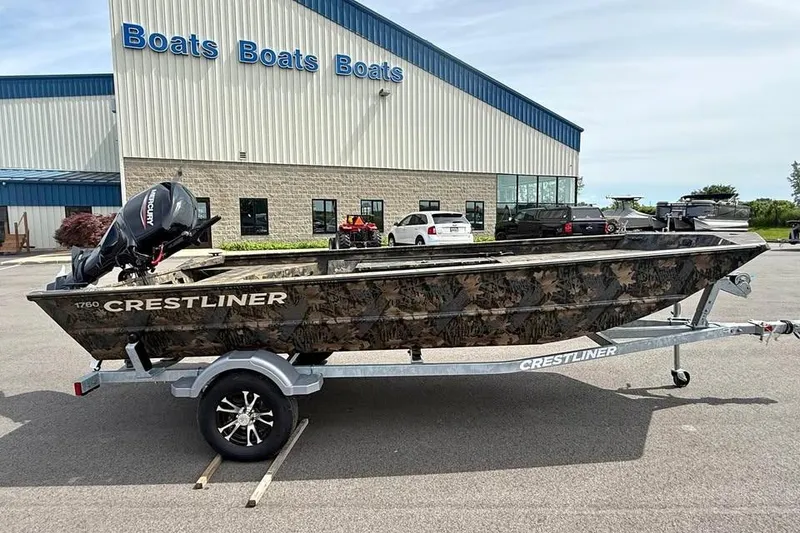 Slide: The Image of 2027 Crestliner 1760 Retriever Jon boat on trailer outside dealership. - 3