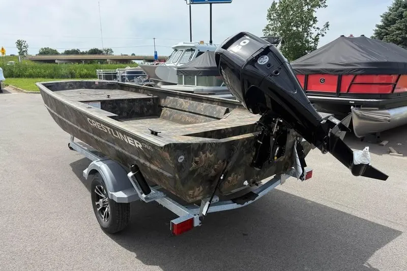 Slide: The Image of 2027 Crestliner 1760 Retriever Jon boat with outboard motor on trailer. - 4