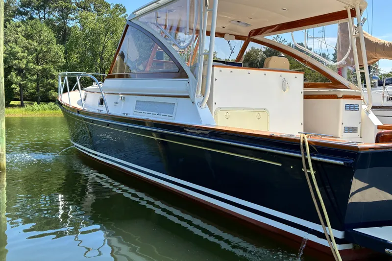 Slide: The Image of 2000 Little Harbor WhisperJet 40 boat docked on calm water. - 2