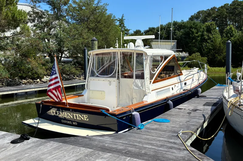 The Image of Little Harbor WhisperJet 40 boat docked, 2000 model, named Clementine, with American flag. - 0