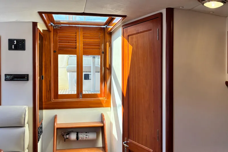 Slide: The Image of Interior of 2000 Little Harbor WhisperJet 40 with wooden finishes and window. - 22