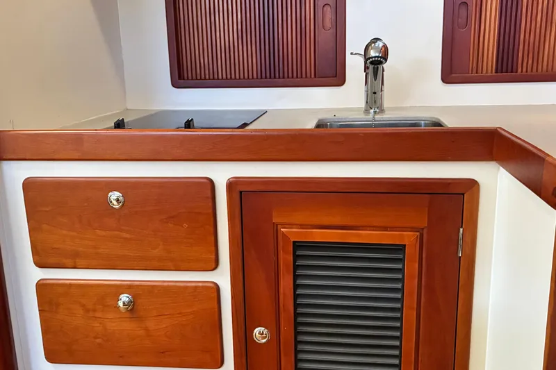 Slide: The Image of Wooden cabinetry and sink in 2000 Little Harbor WhisperJet 40 yacht interior. - 25