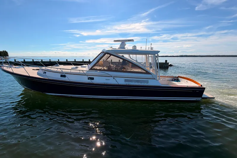 Slide: The Image of Little Harbor WhisperJet 40 yacht from 2000 on calm waters under a clear sky. - 45