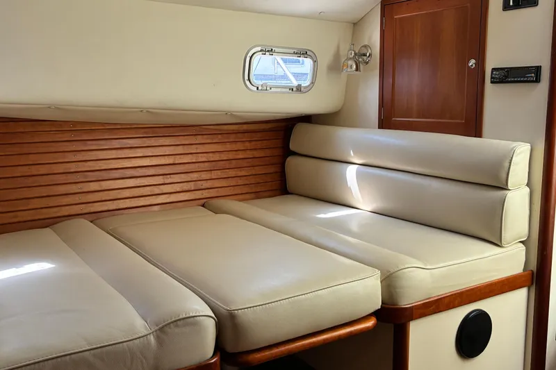 Slide: The Image of Interior of 2000 Little Harbor WhisperJet 40 with beige seating and wooden accents. - 38