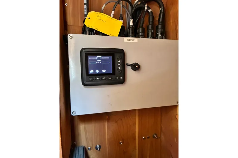 Slide: The Image of Electrical control panel inside a 2000 Little Harbor WhisperJet 40 boat. - 51