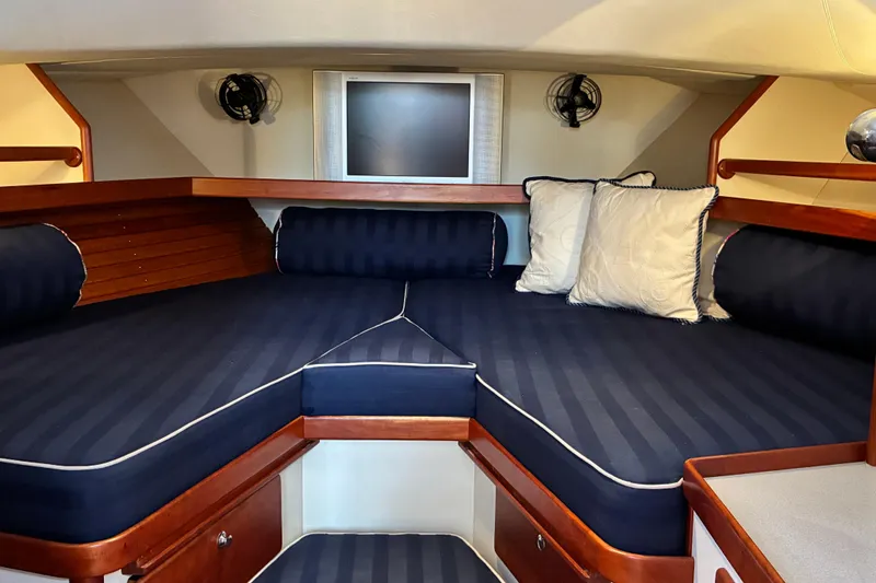 Slide: The Image of Interior cabin of 2000 Little Harbor WhisperJet 40 with cozy seating and TV. - 40