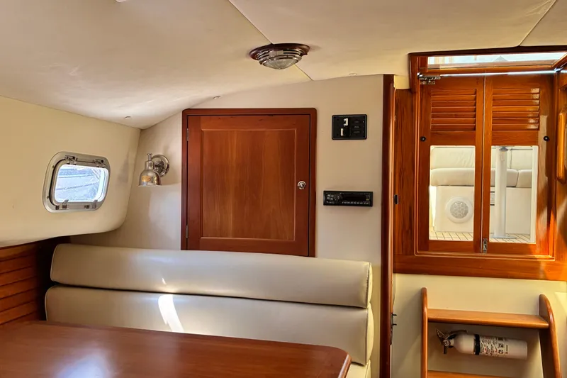 Slide: The Image of Interior of 2000 Little Harbor WhisperJet 40 yacht with wooden accents and seating area. - 21