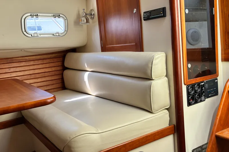 Slide: The Image of Interior of 2000 Little Harbor WhisperJet 40 with beige seating and wooden accents. - 37