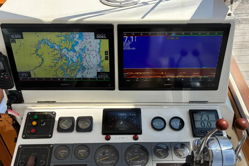 Slide: The Image of Control panel of a 2000 Little Harbor WhisperJet 40 with navigation and sonar displays. - 14