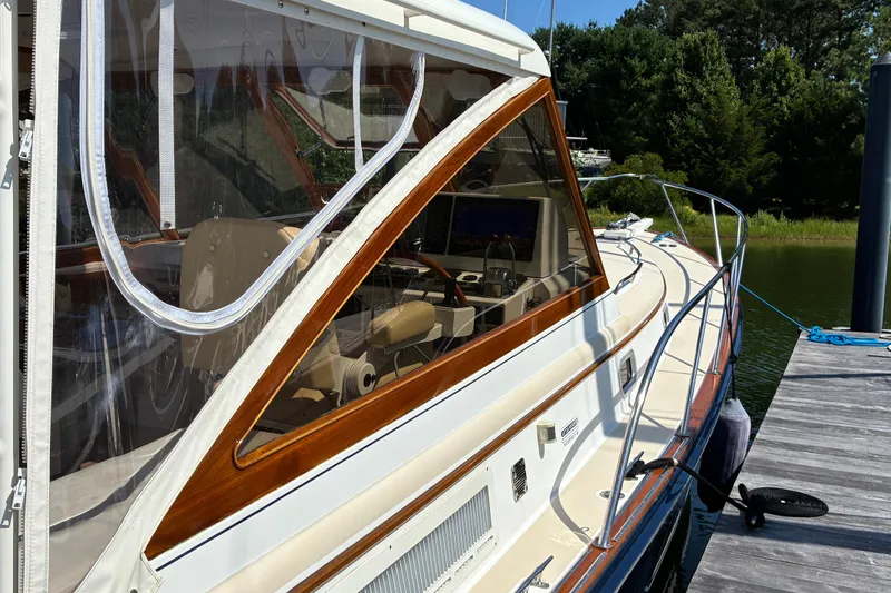 Slide: The Image of 2000 Little Harbor WhisperJet 40 yacht docked, showcasing sleek design and polished wood accents. - 3
