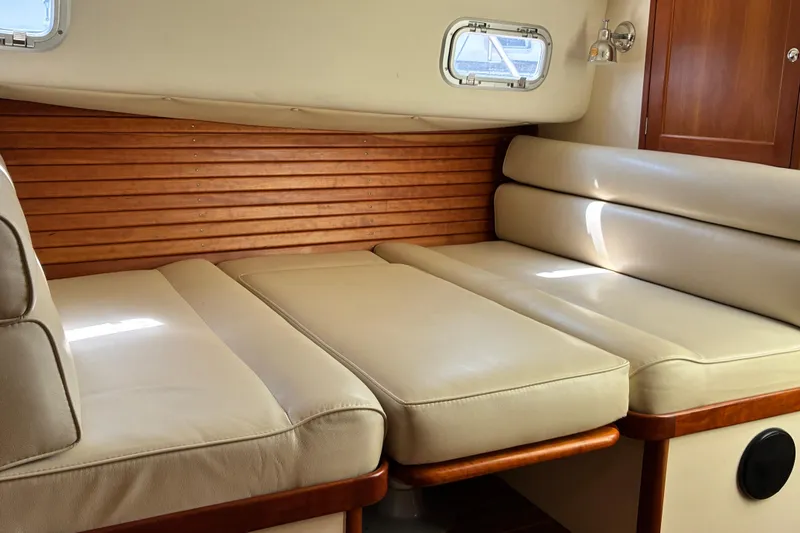 Slide: The Image of Interior of 2000 Little Harbor WhisperJet 40 with beige leather seating and wooden accents. - 39