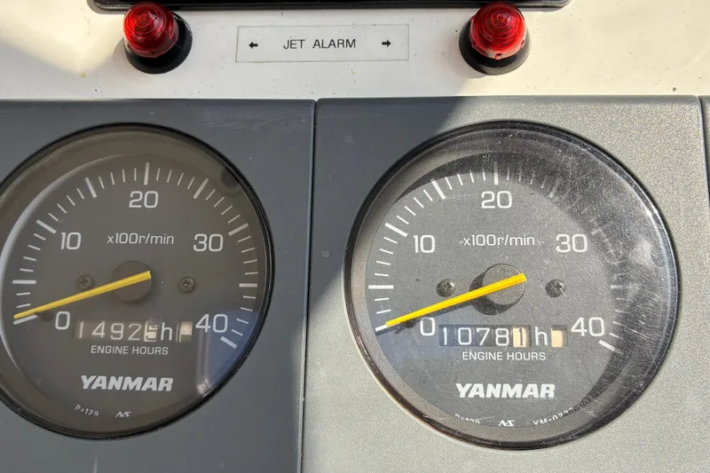 Slide: The Image of Instrument panel of a 2000 Little Harbor WhisperJet 40, showing Yanmar engine hours. - 58
