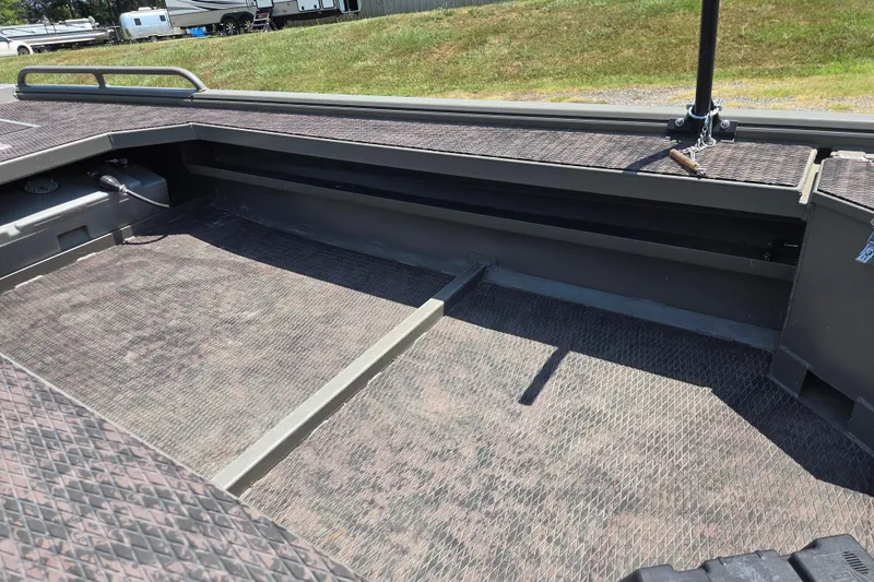 Slide: The Image of 2024 Gator Tail Extreme series boat interior with textured flooring and storage compartments. - 12