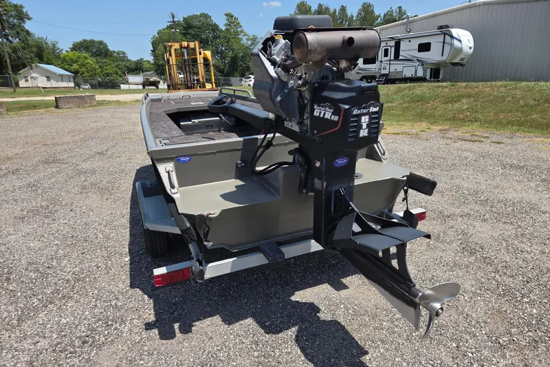 Slide: The Image of 2024 Gator Tail Extreme series boat with powerful outboard motor on a trailer. - 7