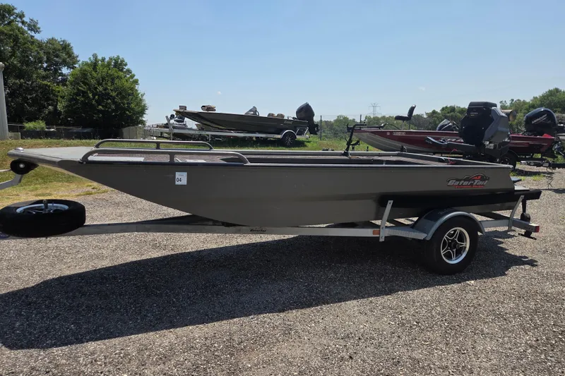 The Image of 2024 Gator Tail Extreme series boat on trailer, parked outdoors under clear sky. - 1