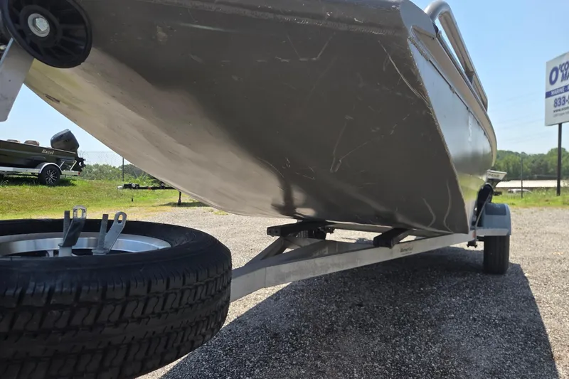 Slide: The Image of 2024 Gator Tail Extreme series boat on trailer, showcasing hull and wheel detail. - 3