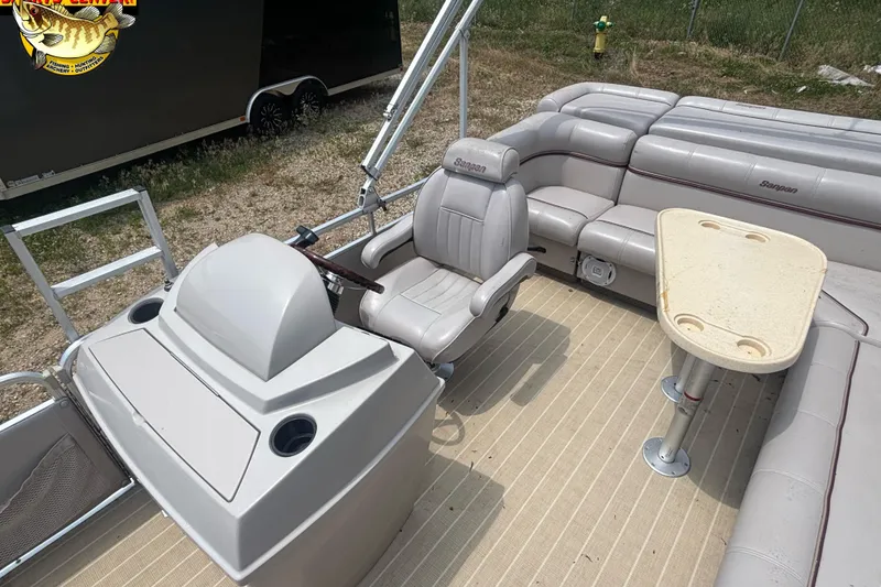 Slide: The Image of 2003 Sanpan 2200 LE pontoon boat interior with helm, seating, and table. - 11