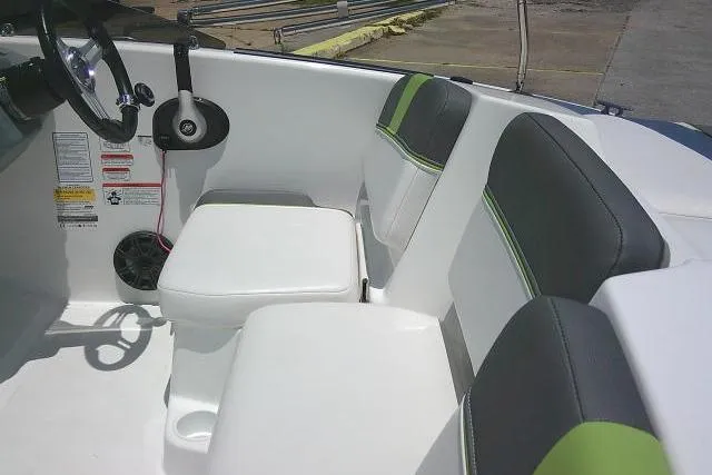 Slide: The Image of Interior of a 2022 Tahoe T16 boat with white and green seating. - 11