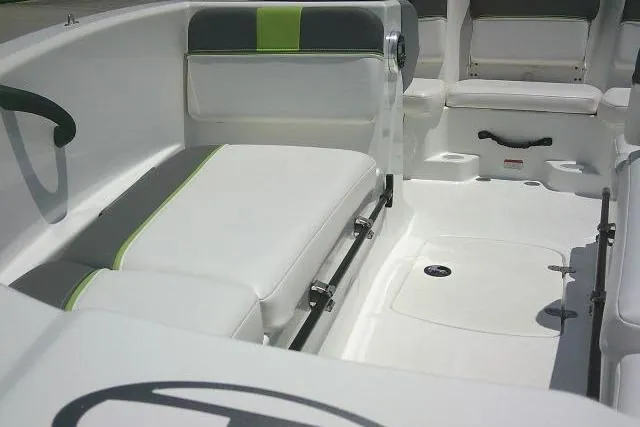 Slide: The Image of 2022 Tahoe T16 boat interior with white and green seating, modern design. - 15