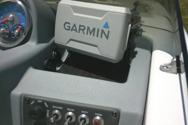 Slide: The Image of Dashboard of a 2022 Tahoe T16 boat featuring Garmin navigation system. - 20