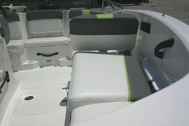 Slide: The Image of Interior of a 2022 Tahoe T16 boat with white and gray seating. - 16