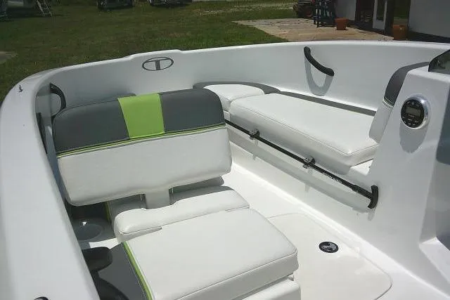 Slide: The Image of 2022 Tahoe T16 boat interior with white and green seating, sleek design. - 10