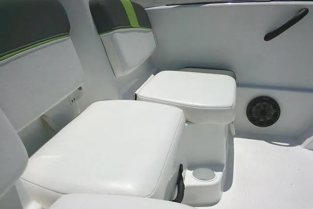 Slide: The Image of 2022 Tahoe T16 boat interior with white seating and green accents. - 19