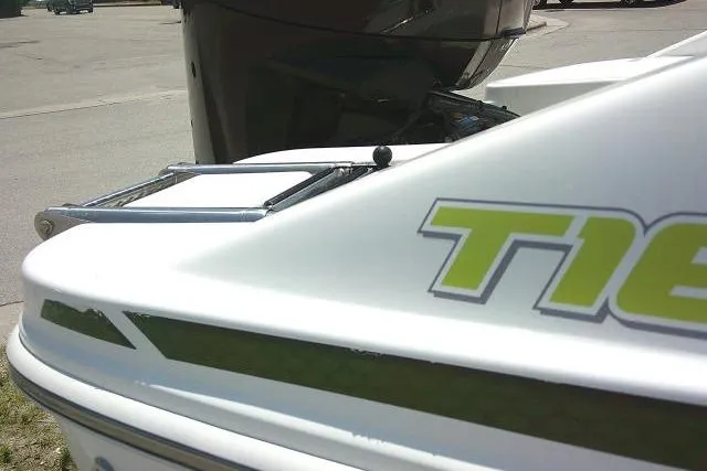 Slide: The Image of 2022 Tahoe T16 boat rear view with ladder and model branding. - 7