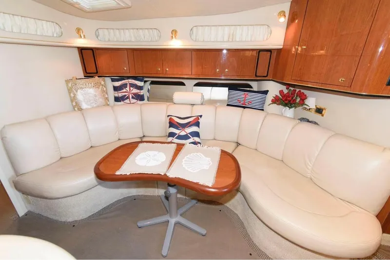 Slide: The Image of Luxurious interior of 1999 Sea Ray Sundancer 400 yacht with plush seating and elegant decor. - 8