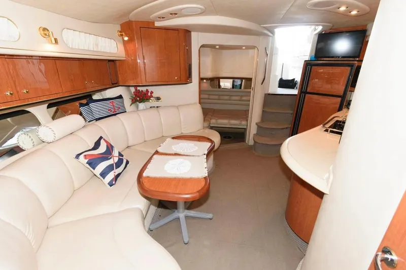 Slide: The Image of Luxurious interior of a 1999 Sea Ray Sundancer 400 yacht with elegant seating and wood finishes. - 7
