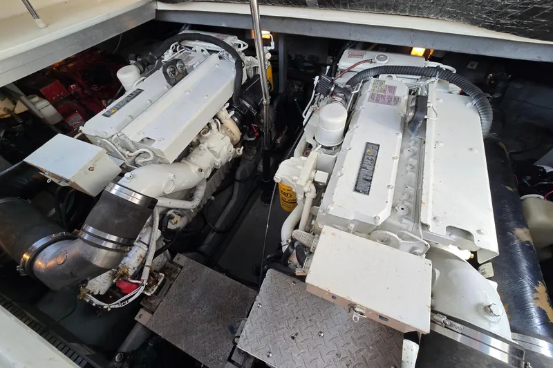 Slide: The Image of Engine room of a 1999 Sea Ray Sundancer 400, showcasing dual marine engines. - 22